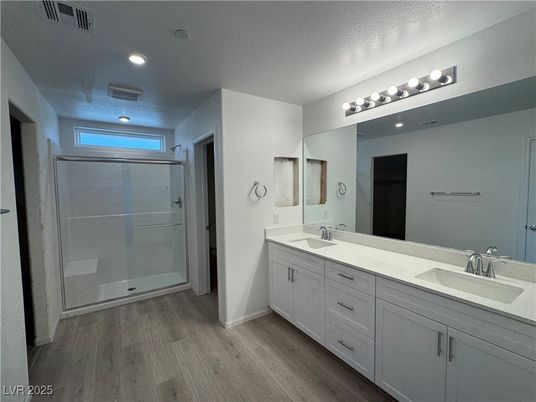 Bathroom, Dual Sink Vanities, Glass Shower, Interior, Recessed Lighting, Wood Texture Flooring