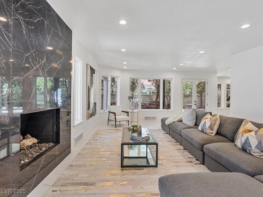 Fireplace, Interior, Living room, Marble Walls, Recessed Lighting, Wood Texture Flooring