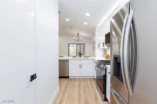 Chandelier, Interior, Kitchen, Recessed Lighting, Stainless Steel Appliances, Wood Texture Flooring