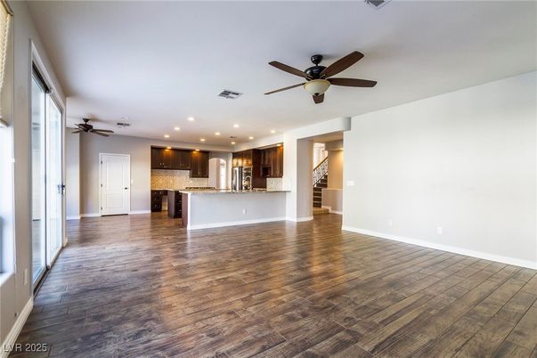 Empty room, Interior, Kitchen, Recessed Lighting, Stainless Steel Appliances, Wood Texture Flooring