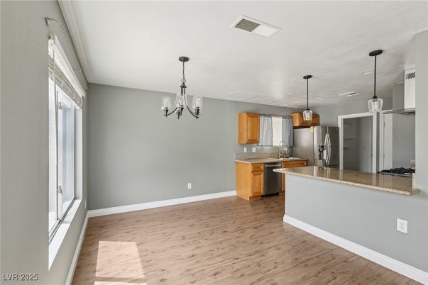 Chandelier, Interior, Kitchen, Pendant Lights, Stainless Steel Appliances, Wood Texture Flooring
