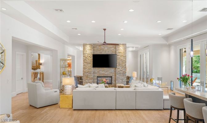 Fireplace, Interior, Living room, Recessed Lighting, Stone Walls, Wood Texture Flooring