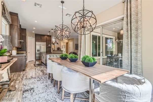 Chandelier, Dining room, Interior, Kitchen, Pendant Lights, Recessed Lighting, Stainless Steel Appliances, Wood Texture Flooring