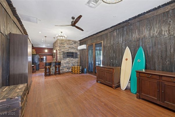 Fireplace, Interior, Pendant Lights, Recessed Lighting, Stone Walls, Wood Texture Flooring