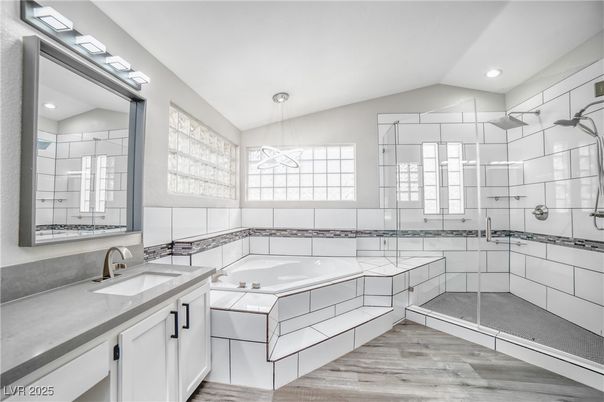 Bathroom, Dual Sink Vanities, Glass Shower, Interior, Pendant Lights, Recessed Lighting, Wood Texture Flooring