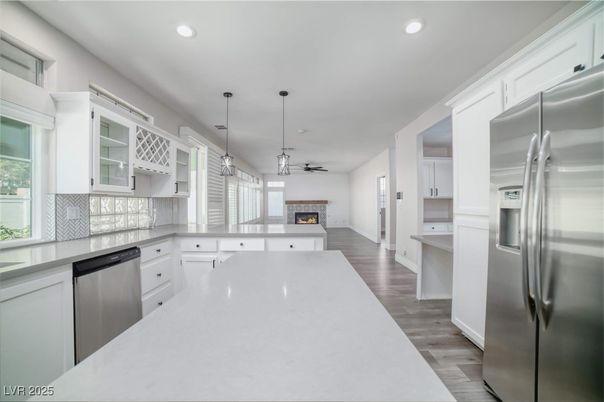 Fireplace, Interior, Kitchen, Pendant Lights, Recessed Lighting, Stainless Steel Appliances, Wood Texture Flooring