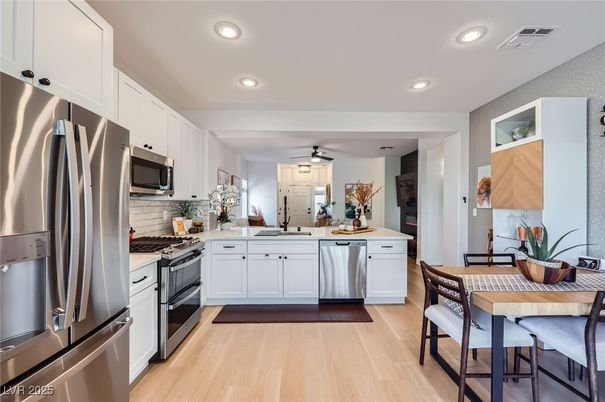 Dining room, Interior, Kitchen, Recessed Lighting, Stainless Steel Appliances, Wood Texture Flooring