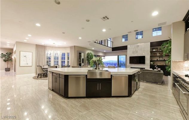 Chandelier, Dining room, Fireplace, Interior, Kitchen, Living room, Pendant Lights, Recessed Lighting, Stainless Steel Appliances