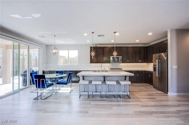 Dining room, Interior, Kitchen, Pendant Lights, Recessed Lighting, Stainless Steel Appliances, Wood Texture Flooring