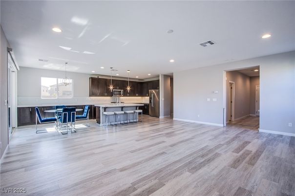 Chandelier, Dining room, Interior, Kitchen, Pendant Lights, Recessed Lighting, Stainless Steel Appliances, Wood Texture Flooring