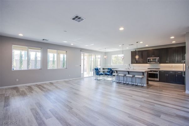 Dining room, Interior, Kitchen, Pendant Lights, Recessed Lighting, Stainless Steel Appliances, Wood Texture Flooring
