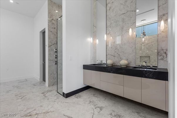 Bathroom, Dual Sink Vanities, Interior, Marble, Marble Walls, Pendant Lights, Recessed Lighting