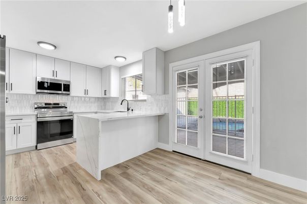 Interior, Kitchen, Pendant Lights, Recessed Lighting, Stainless Steel Appliances, Wood Texture Flooring