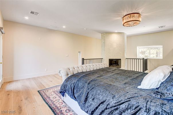 Bedroom, Chandelier, Fireplace, Interior, Recessed Lighting, Wood Texture Flooring