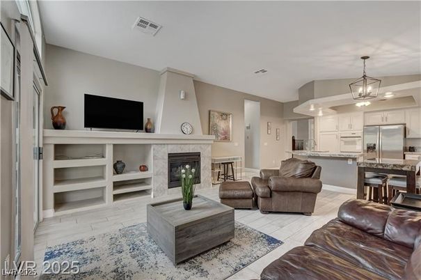 Fireplace, Interior, Kitchen, Living room, Pendant Lights, Stainless Steel Appliances, Wood Texture Flooring
