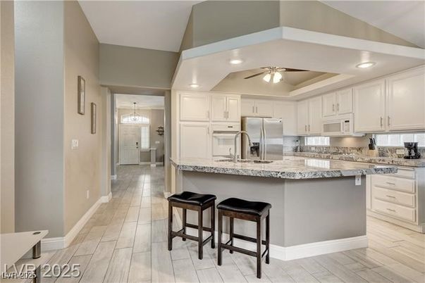 Chandelier, Interior, Kitchen, Pendant Lights, Recessed Lighting, Stainless Steel Appliances, Wood Texture Flooring