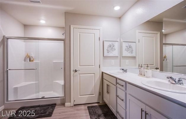 Bathroom, Dual Sink Vanities, Glass Shower, Interior, Recessed Lighting, Wood Texture Flooring
