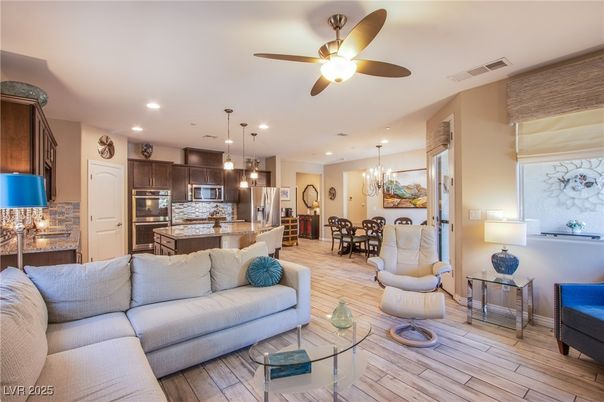 Chandelier, Dining room, Interior, Kitchen, Living room, Pendant Lights, Recessed Lighting, Stainless Steel Appliances, Wood Texture Flooring