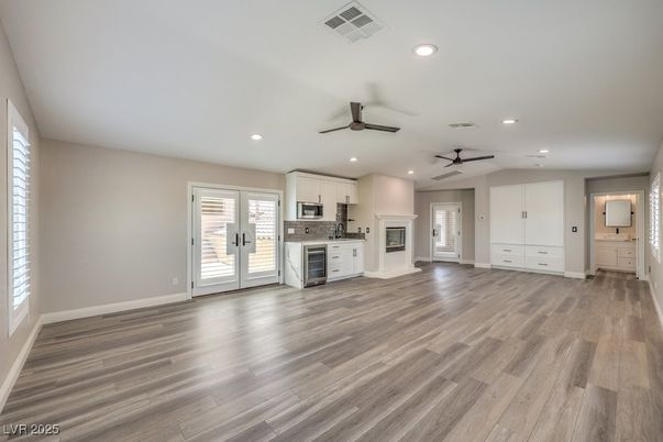 Empty room, Fireplace, Interior, Kitchen, Recessed Lighting, Wood Texture Flooring