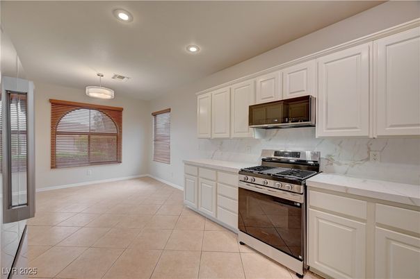 Interior, Kitchen, Marble Walls, Recessed Lighting, Stainless Steel Appliances