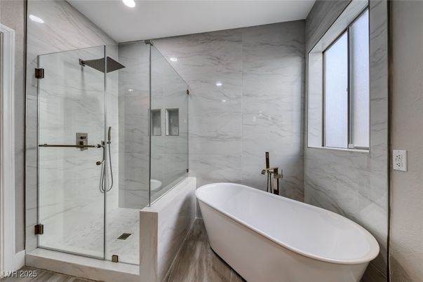 Bathroom, Free Standing Baths, Glass Shower, Interior, Marble Walls, Recessed Lighting
