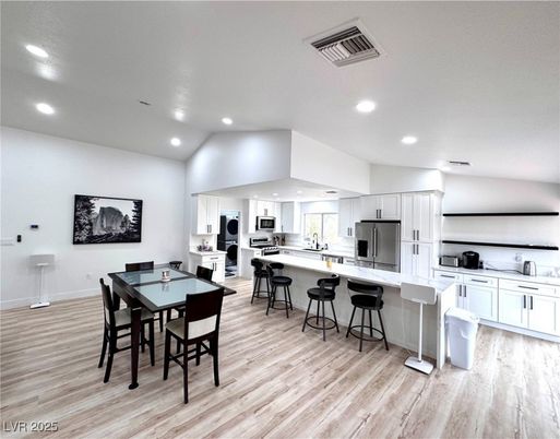 Dining room, Interior, Kitchen, Recessed Lighting, Stainless Steel Appliances, Wood Texture Flooring