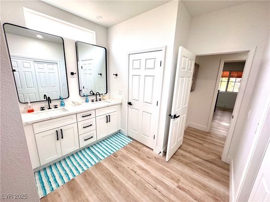 Bathroom, Dual Sink Vanities, Interior, Recessed Lighting, Wood Texture Flooring