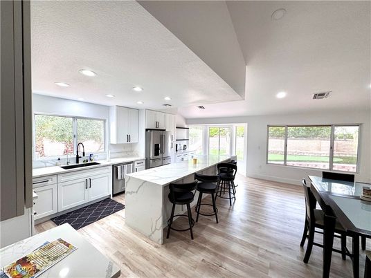 Dining room, Interior, Kitchen, Recessed Lighting, Stainless Steel Appliances, Wood Texture Flooring
