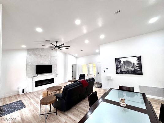 Dining room, Fireplace, Interior, Living room, Recessed Lighting, Wood Texture Flooring