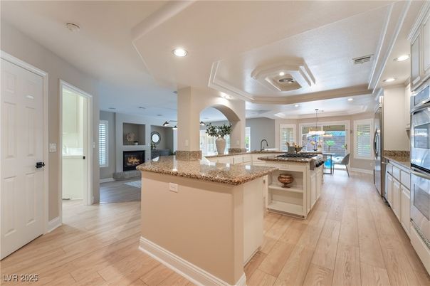 Dining room, Fireplace, Interior, Kitchen, Pendant Lights, Recessed Lighting, Wood Texture Flooring