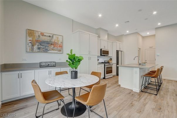 Dining room, Interior, Kitchen, Recessed Lighting, Stainless Steel Appliances, Wood Texture Flooring