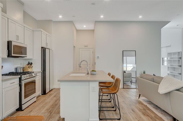 Dining room, Interior, Kitchen, Living room, Recessed Lighting, Stainless Steel Appliances, Wood Texture Flooring