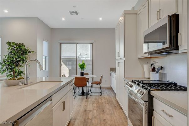 Dining room, Interior, Kitchen, Recessed Lighting, Stainless Steel Appliances, Wood Texture Flooring