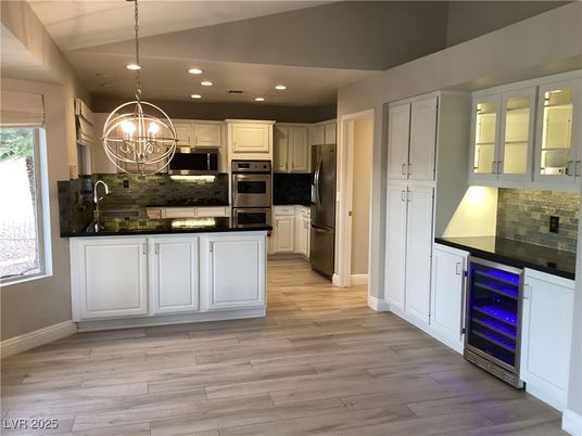 Chandelier, Interior, Kitchen, Pendant Lights, Recessed Lighting, Stainless Steel Appliances, Wood Texture Flooring