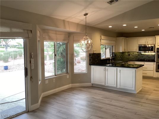 Chandelier, Interior, Kitchen, Pendant Lights, Recessed Lighting, Stainless Steel Appliances, Wood Texture Flooring