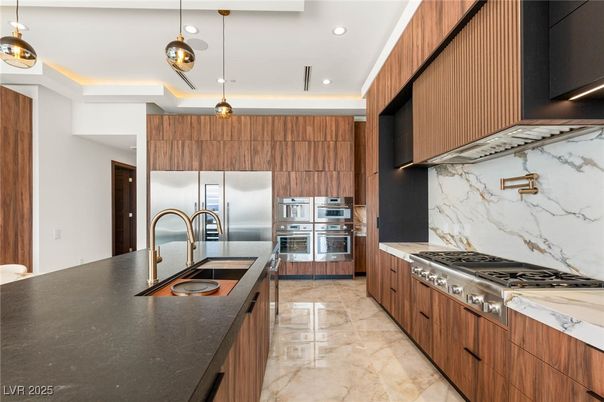 Interior, Kitchen, Marble Walls, Pendant Lights, Recessed Lighting, Stainless Steel Appliances