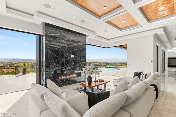 Fireplace, Interior, Living room, Marble Walls, Recessed Lighting, Water, Wooden Ceilings