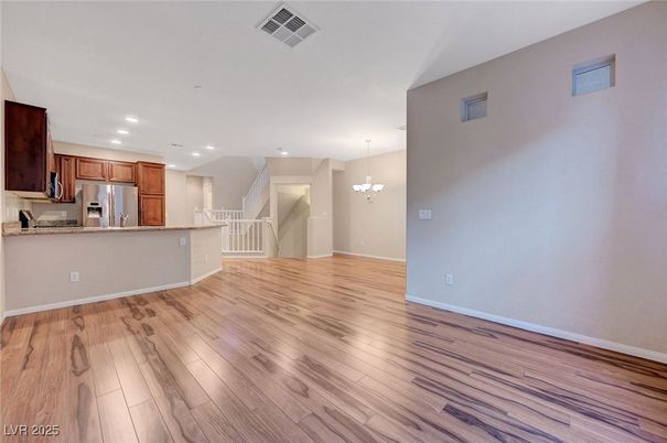 Chandelier, Empty room, Interior, Kitchen, Recessed Lighting, Stainless Steel Appliances, Wood Texture Flooring
