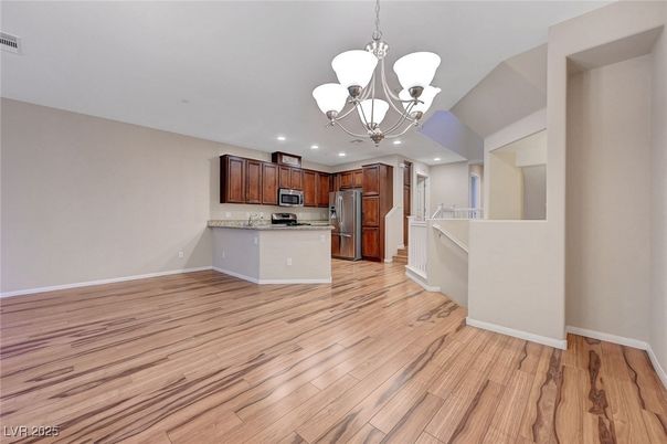 Chandelier, Empty room, Interior, Kitchen, Recessed Lighting, Stainless Steel Appliances, Wood Texture Flooring
