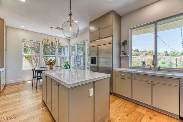 Chandelier, Dining room, Interior, Kitchen, Pendant Lights, Recessed Lighting, Stainless Steel Appliances, Wood Texture Flooring
