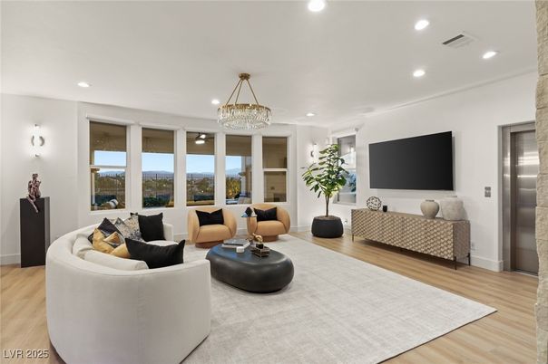 Chandelier, Elevator, Interior, Living room, Recessed Lighting, Wood Texture Flooring