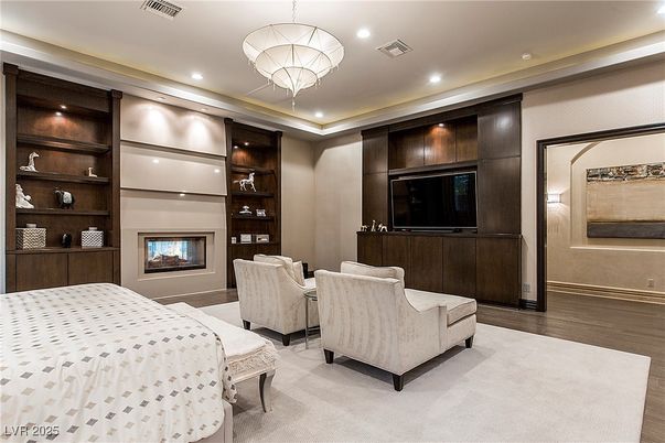 Bedroom, Chandelier, Fireplace, Interior, Recessed Lighting, Wood Texture Flooring