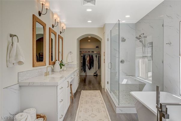 Bathroom, Dual Sink Vanities, Glass Shower, Interior, Marble Walls, Recessed Lighting, Walk-in Closets, Wood Texture Flooring