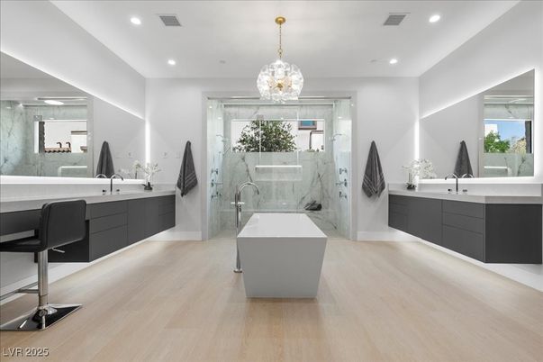 Bathroom, Dual Sink Vanities, Free Standing Baths, Interior, Marble Walls, Pendant Lights, Recessed Lighting, Wood Texture Flooring
