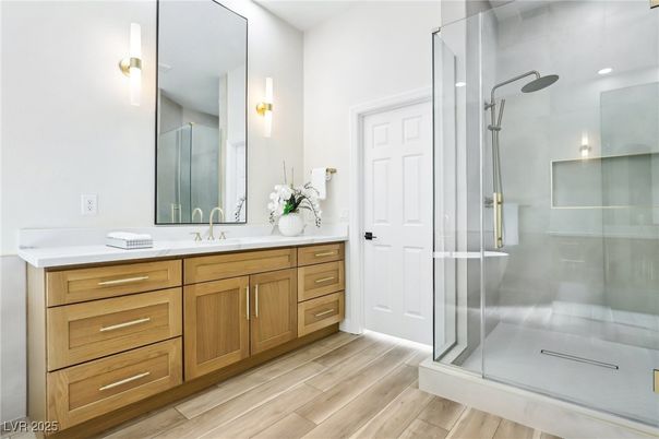 Bathroom, Dual Sink Vanities, Glass Shower, Interior, Recessed Lighting, Wood Texture Flooring