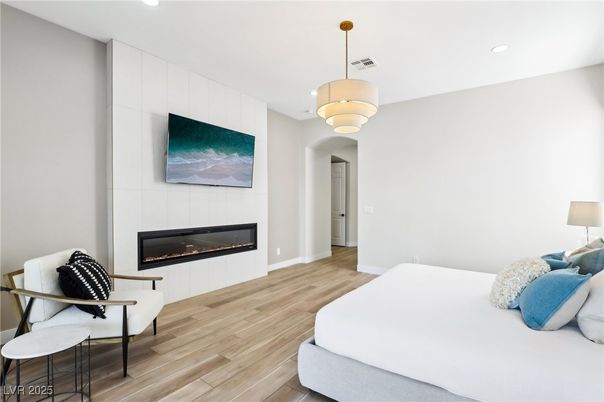 Bedroom, Fireplace, Interior, Pendant Lights, Recessed Lighting, Wood Texture Flooring