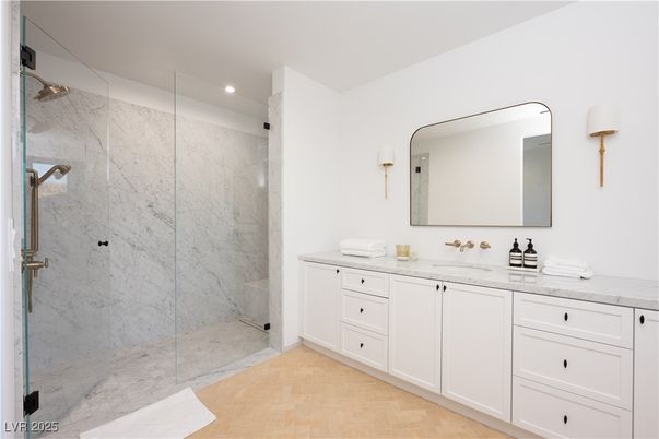 Bathroom, Dual Sink Vanities, Glass Shower, Interior, Marble Walls, Recessed Lighting, Wood Texture Flooring