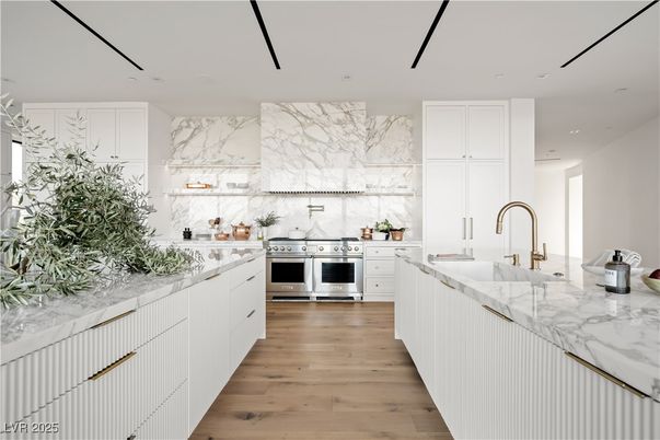 Interior, Kitchen, Marble Walls, Recessed Lighting, Stainless Steel Appliances, Wood Texture Flooring