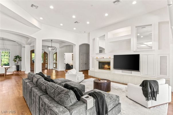 Chandelier, Fireplace, Interior, Living room, Pendant Lights, Recessed Lighting, Wood Texture Flooring