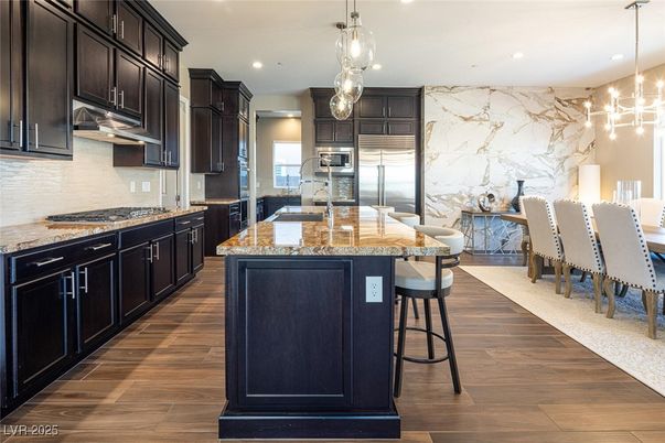 Interior, Kitchen, Marble Walls, Pendant Lights, Recessed Lighting, Stainless Steel Appliances, Wood Texture Flooring